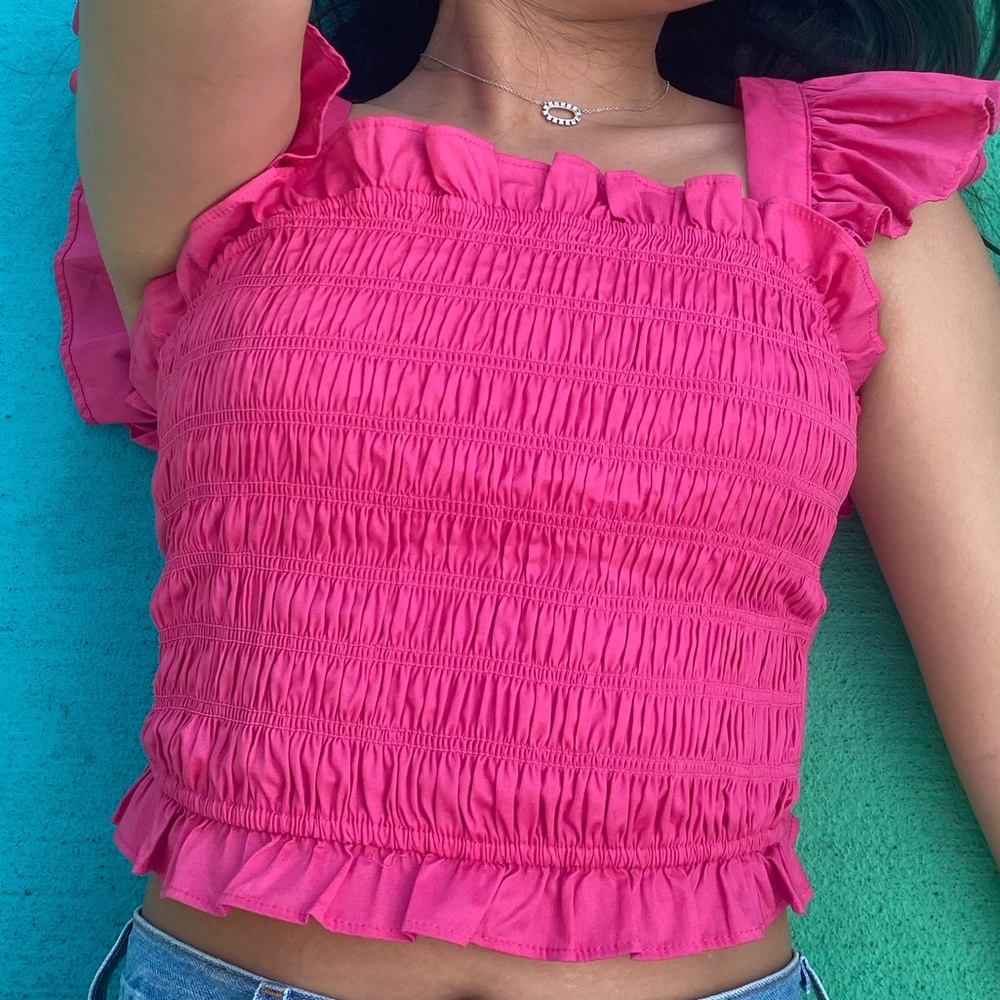 Pink ruffle smocked top with bow back